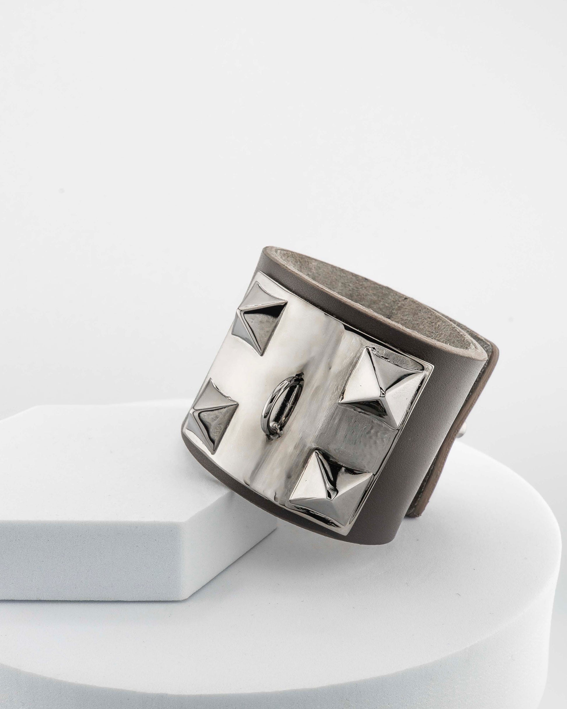 Leather bracelet with, bronze pyramids plated in 18K gold.
An original Marri Cortona design — handmade in Tuscany.