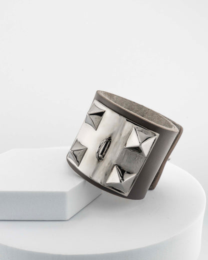 Leather bracelet with, bronze pyramids plated in 18K gold.
An original Marri Cortona design — handmade in Tuscany.