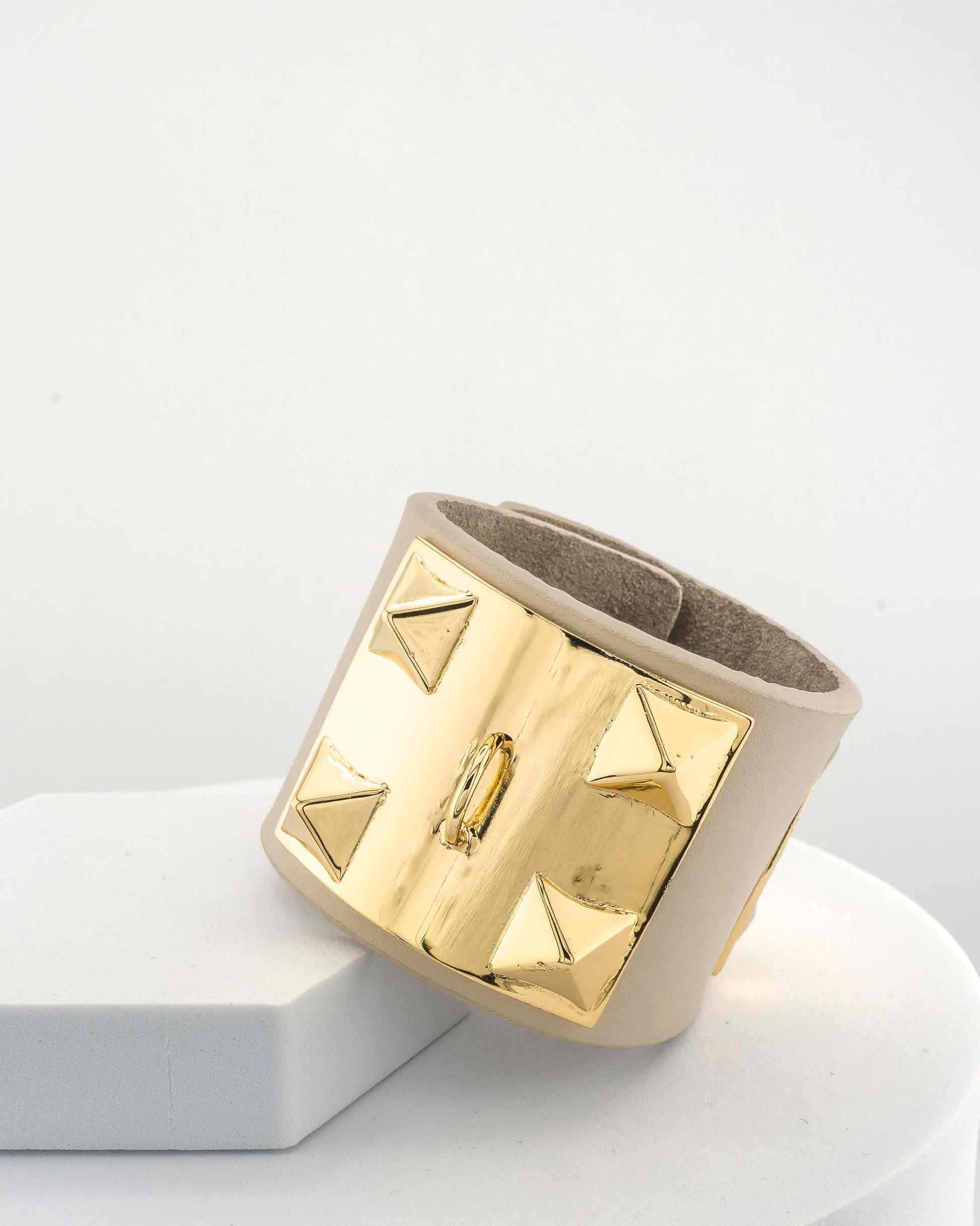 Leather bracelet with, bronze pyramids plated in 18K gold.
An original Marri Cortona design — handmade in Tuscany.