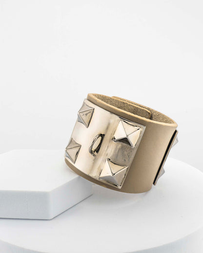 Leather bracelet with, bronze pyramids plated in 18K gold.
An original Marri Cortona design — handmade in Tuscany.