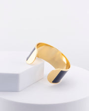 Handcrafted in Tuscany, the MarriCortona Smalto Bracelets in 18k gold and hand-painted enamel feature bold 30 mm bands — radiant, elegant, and uniquely Italian.