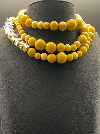 Octopus necklace with elements in genuine python skin, wood and resin