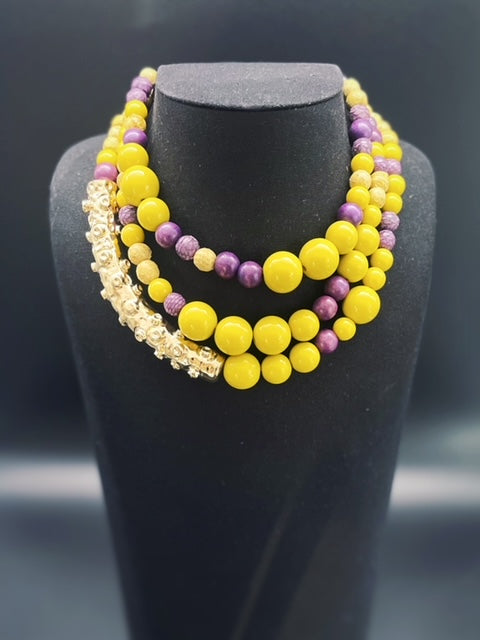 Collana Octopus con elementi  in vera pelle di pitone, legno e resina