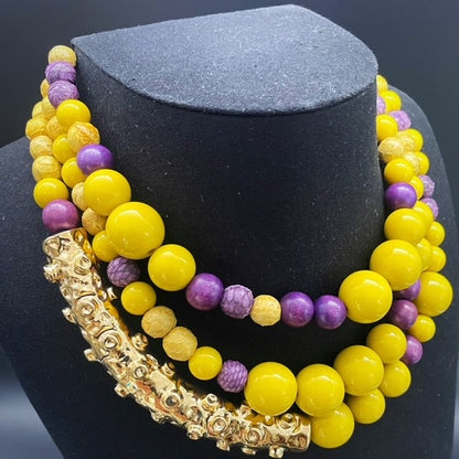 Octopus necklace with elements in genuine python skin, wood and resin