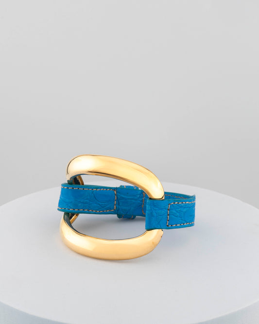 Handcrafted 18K gold-plated bronze bracelet with genuine crocodile leather strap.
An original Marri Cortona design — handmade in Tuscany.