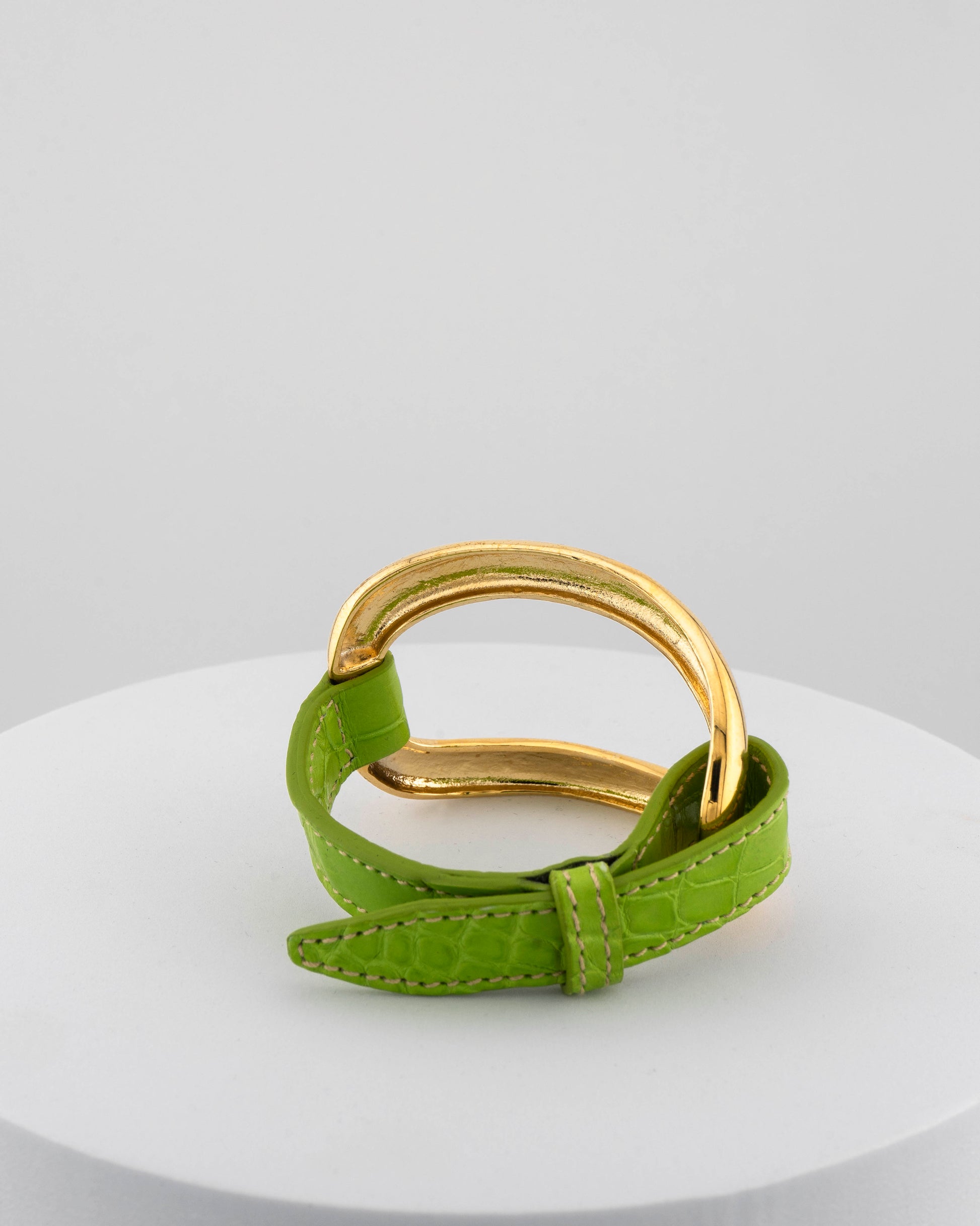 Handcrafted 18K gold-plated bronze bracelet with genuine crocodile leather strap.
An original Marri Cortona design — handmade in Tuscany.