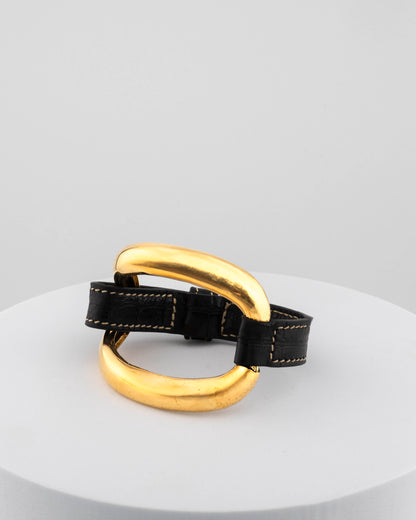 Handcrafted 18K gold-plated bronze bracelet with genuine crocodile leather strap.
An original Marri Cortona design — handmade in Tuscany.