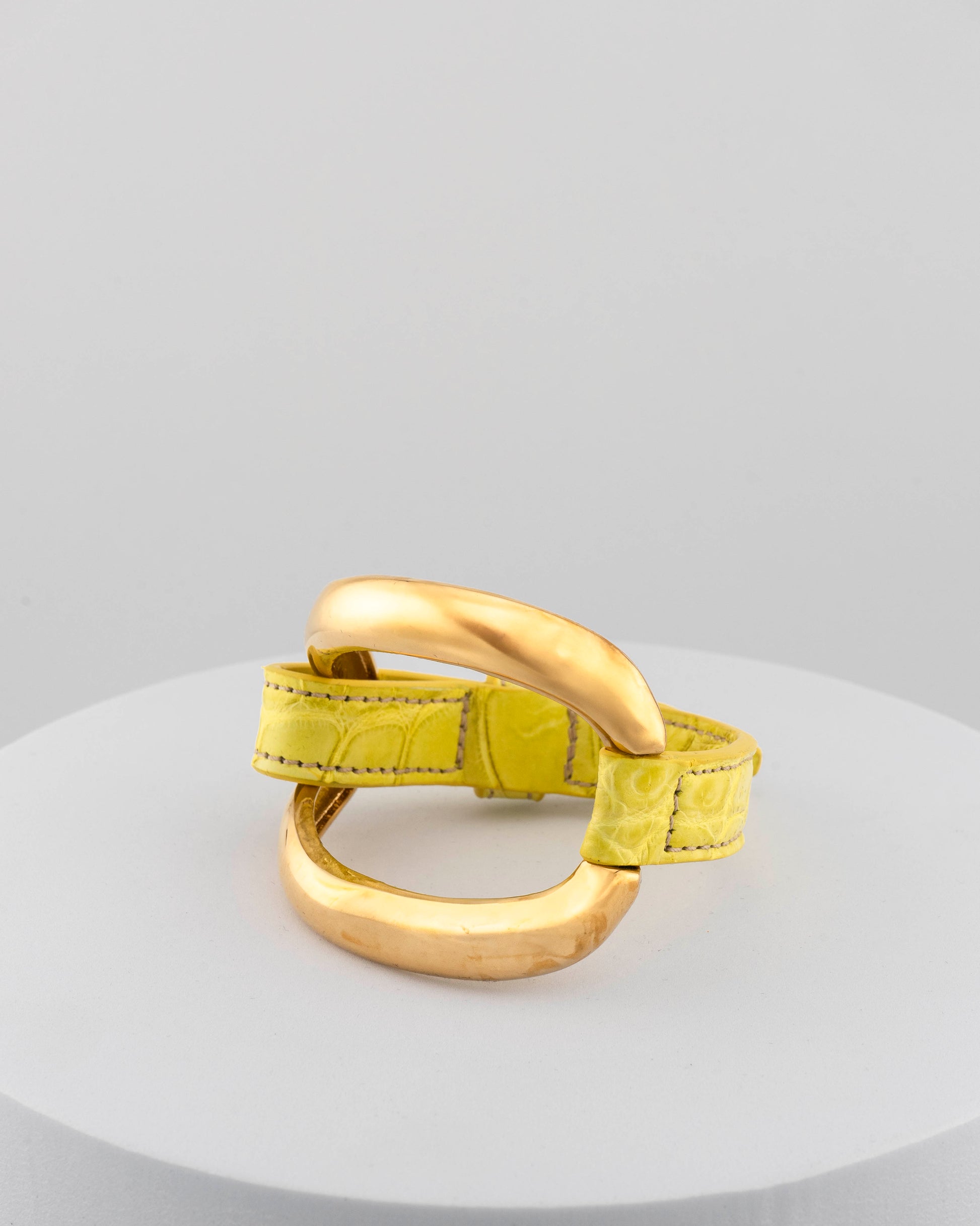 Handcrafted 18K gold-plated bronze bracelet with genuine crocodile leather strap.
An original Marri Cortona design — handmade in Tuscany.