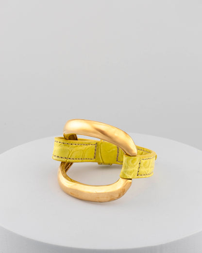 Handcrafted 18K gold-plated bronze bracelet with genuine crocodile leather strap.
An original Marri Cortona design — handmade in Tuscany.