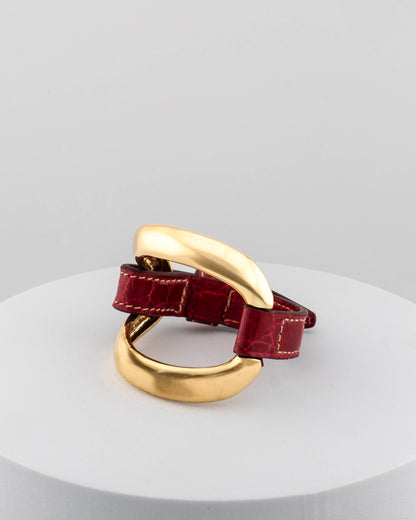 Handcrafted 18K gold-plated bronze bracelet with genuine crocodile leather strap.
An original Marri Cortona design — handmade in Tuscany.