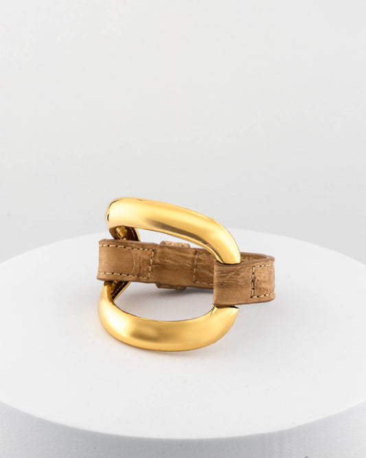 Handcrafted 18K gold-plated bronze bracelet with genuine crocodile leather strap.
An original Marri Cortona design — handmade in Tuscany.