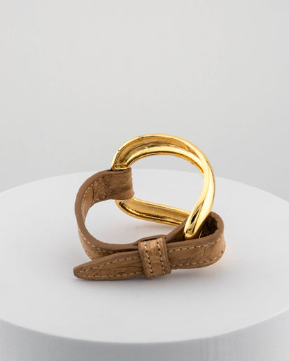 Handcrafted 18K gold-plated bronze bracelet with genuine crocodile leather strap.
An original Marri Cortona design — handmade in Tuscany.