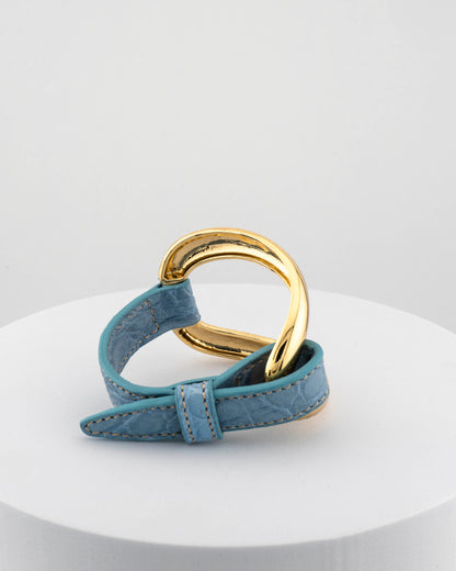 Handcrafted 18K gold-plated bronze bracelet with genuine crocodile leather strap.
An original Marri Cortona design — handmade in Tuscany.