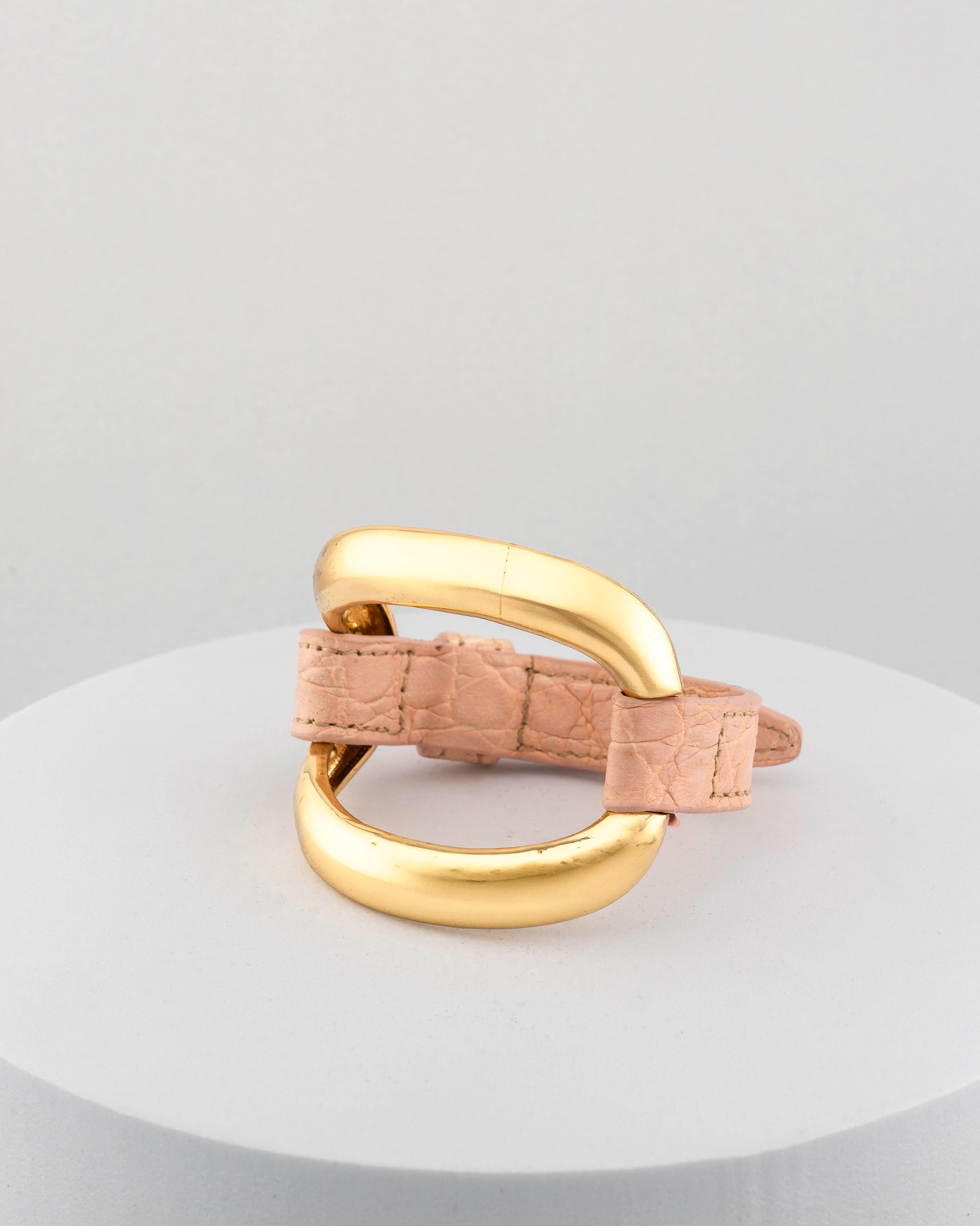 Handcrafted 18K gold-plated bronze bracelet with genuine crocodile leather strap.
An original Marri Cortona design — handmade in Tuscany.