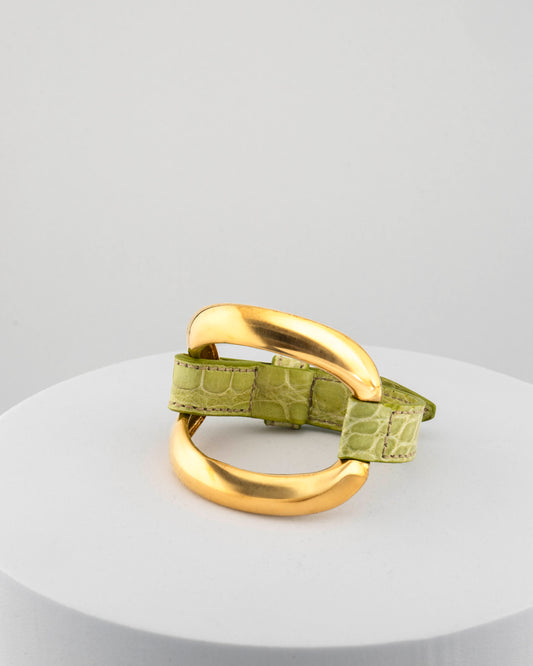 Handcrafted 18K gold-plated bronze bracelet with genuine crocodile leather strap.
An original Marri Cortona design — handmade in Tuscany.