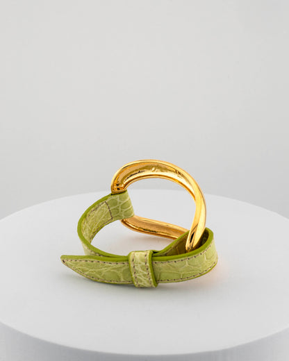 Handcrafted 18K gold-plated bronze bracelet with genuine crocodile leather strap.
An original Marri Cortona design — handmade in Tuscany.