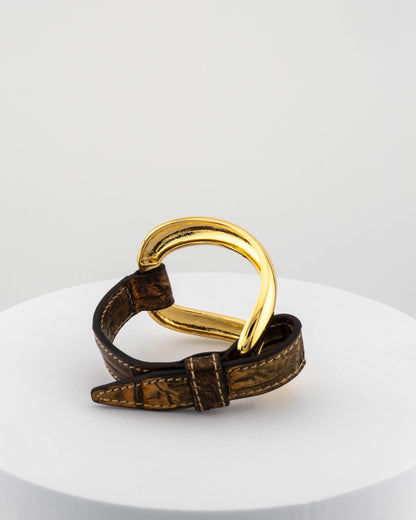 Handcrafted 18K gold-plated bronze bracelet with genuine crocodile leather strap.
An original Marri Cortona design — handmade in Tuscany.