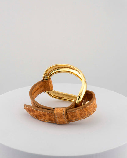 Handcrafted 18K gold-plated bronze bracelet with genuine crocodile leather strap.
An original Marri Cortona design — handmade in Tuscany.