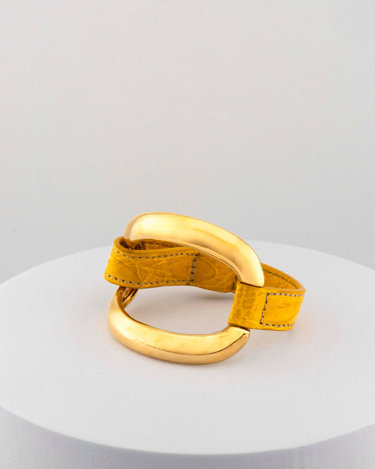 Handcrafted 18K gold-plated bronze bracelet with genuine crocodile leather strap.
An original Marri Cortona design — handmade in Tuscany.