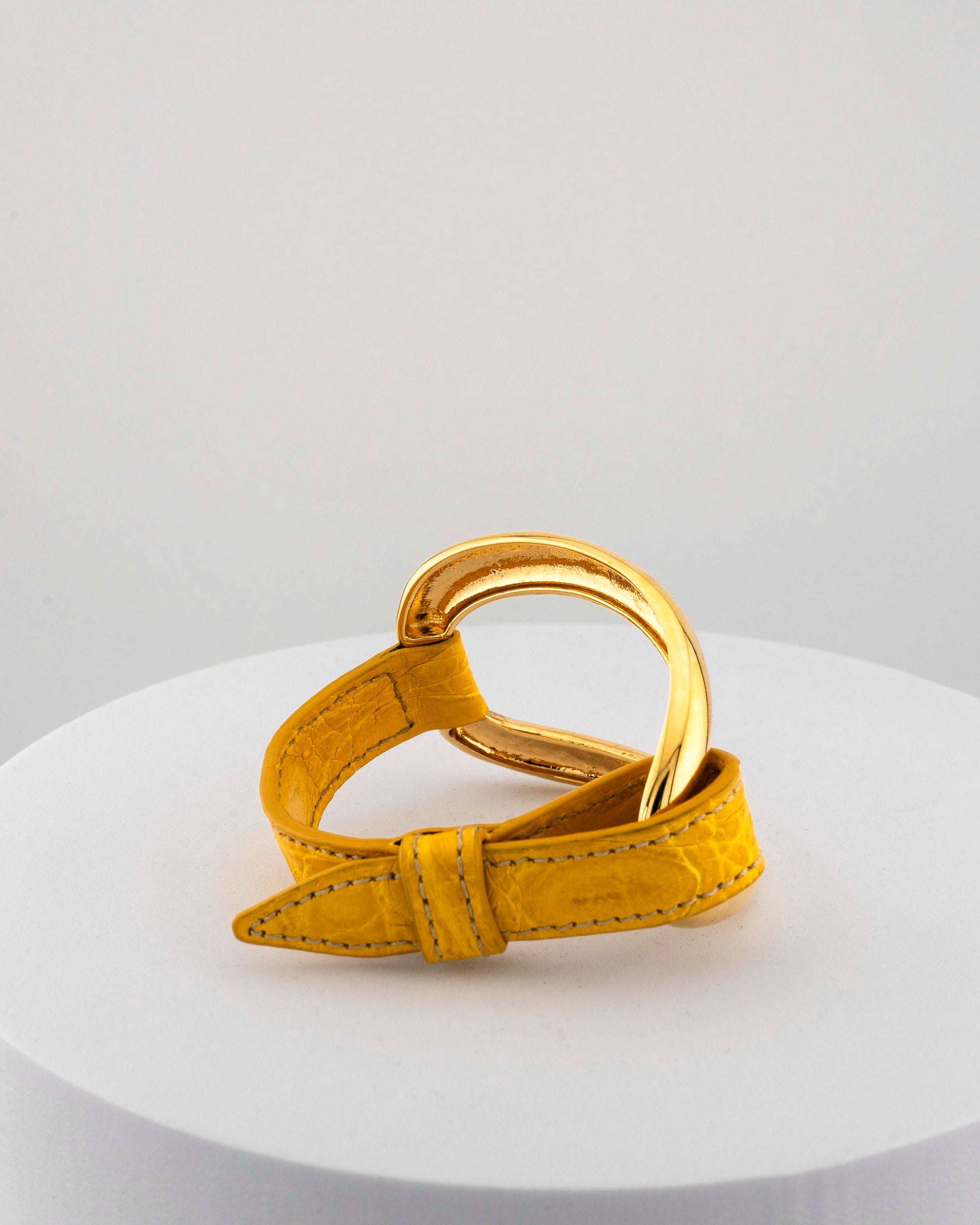 Handcrafted 18K gold-plated bronze bracelet with genuine crocodile leather strap.
An original Marri Cortona design — handmade in Tuscany.