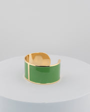 Handcrafted in Tuscany, the MarriCortona Smalto Bracelets in 18k gold and hand-painted enamel feature bold 30 mm bands — radiant, elegant, and uniquely Italian.