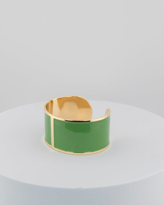 Handcrafted in Tuscany, the MarriCortona Smalto Bracelets in 18k gold and hand-painted enamel feature bold 30 mm bands — radiant, elegant, and uniquely Italian.