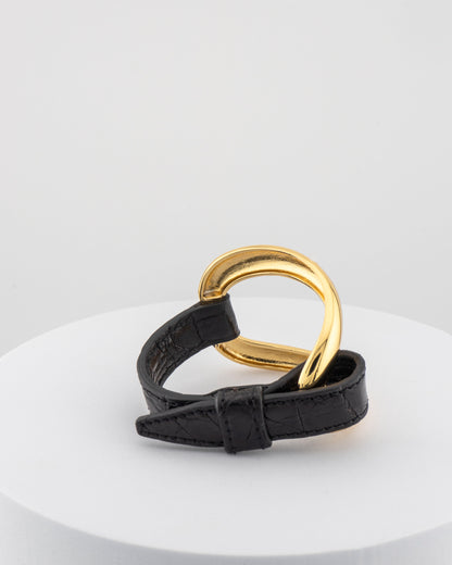 Handcrafted 18K gold-plated bronze bracelet with genuine crocodile leather strap.
An original Marri Cortona design — handmade in Tuscany.