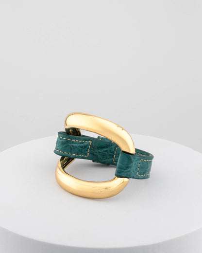 Handcrafted 18K gold-plated bronze bracelet with genuine crocodile leather strap.
An original Marri Cortona design — handmade in Tuscany.