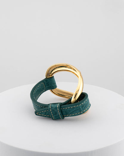 Handcrafted 18K gold-plated bronze bracelet with genuine crocodile leather strap.
An original Marri Cortona design — handmade in Tuscany.