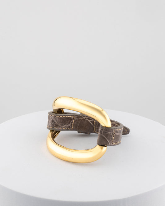 Handcrafted 18K gold-plated bronze bracelet with genuine crocodile leather strap.
An original Marri Cortona design — handmade in Tuscany.