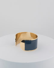 Handcrafted in Tuscany, the MarriCortona Smalto Bracelets in 18k gold and hand-painted enamel feature bold 30 mm bands — radiant, elegant, and uniquely Italian.