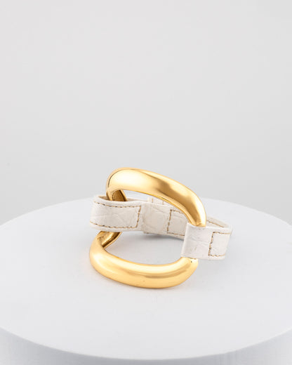 Handcrafted 18K gold-plated bronze bracelet with genuine crocodile leather strap.
An original Marri Cortona design — handmade in Tuscany.