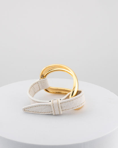 Handcrafted 18K gold-plated bronze bracelet with genuine crocodile leather strap.
An original Marri Cortona design — handmade in Tuscany.