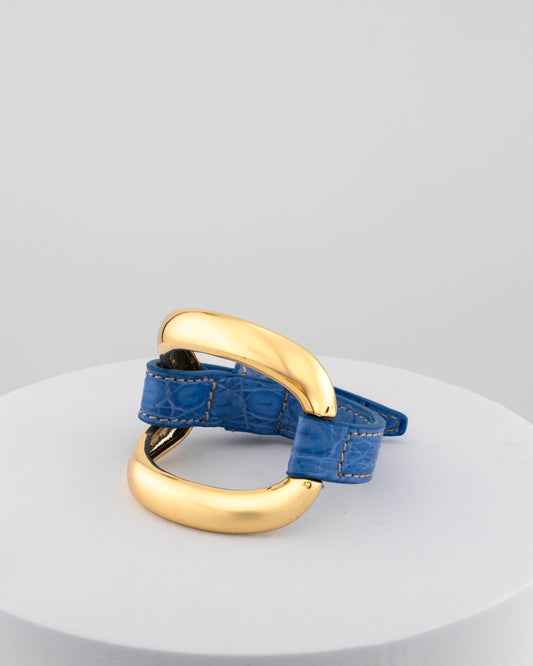 Handcrafted 18K gold-plated bronze bracelet with genuine crocodile leather strap.
An original Marri Cortona design — handmade in Tuscany.