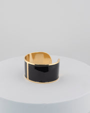 Handcrafted in Tuscany, the MarriCortona Smalto Bracelets in 18k gold and hand-painted enamel feature bold 30 mm bands — radiant, elegant, and uniquely Italian.