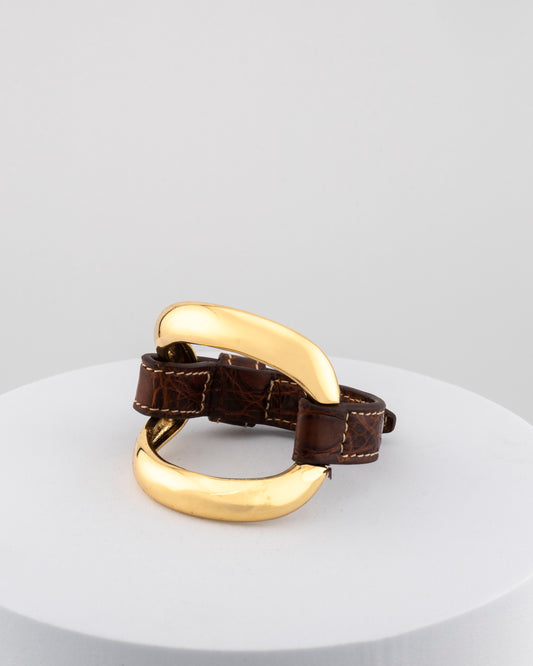 Handcrafted 18K gold-plated bronze bracelet with genuine crocodile leather strap.
An original Marri Cortona design — handmade in Tuscany.
