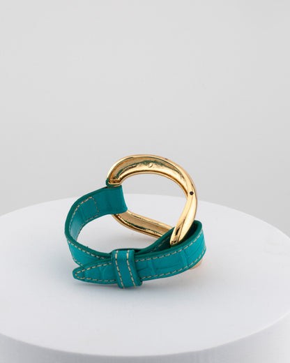 Handcrafted 18K gold-plated bronze bracelet with genuine crocodile leather strap.
An original Marri Cortona design — handmade in Tuscany.