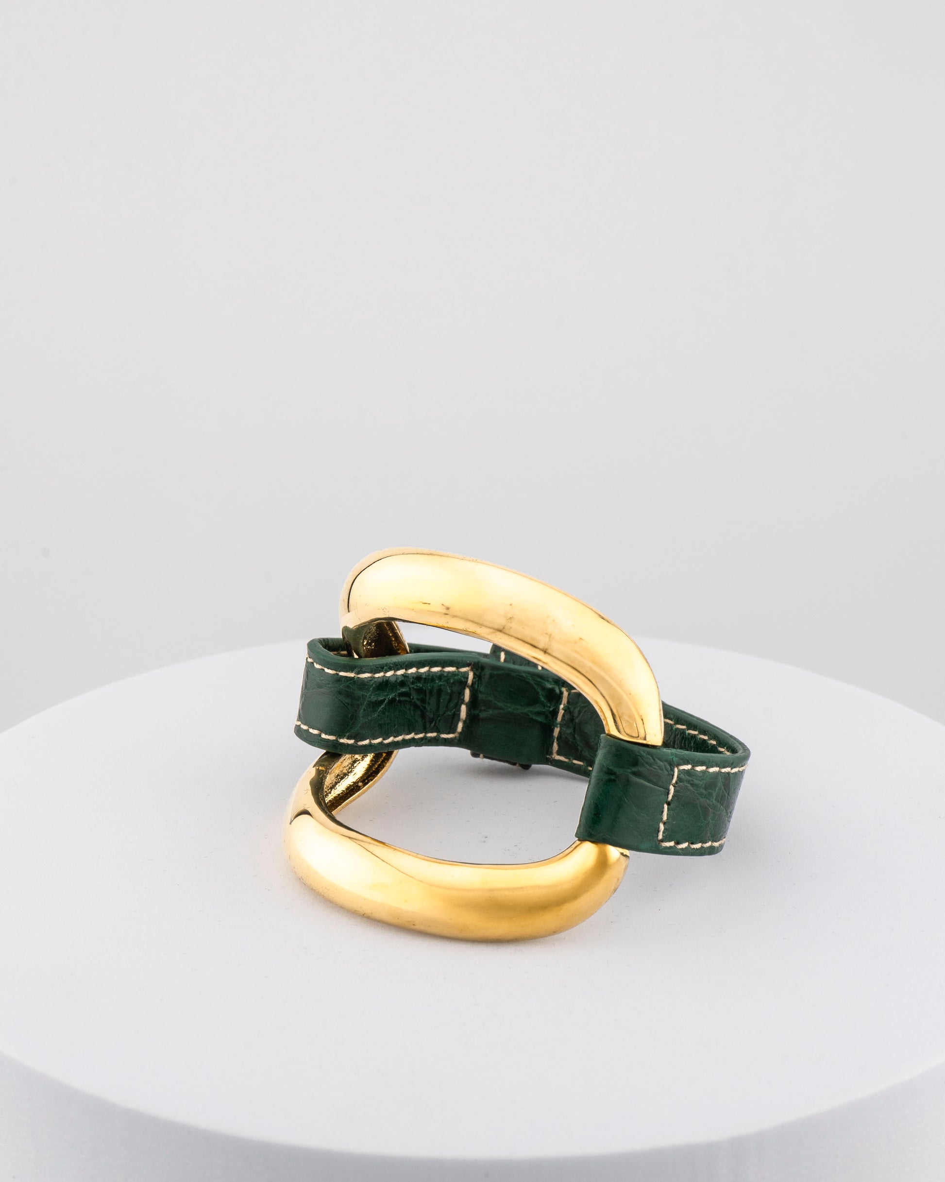 Handcrafted 18K gold-plated bronze bracelet with genuine crocodile leather strap.
An original Marri Cortona design — handmade in Tuscany.