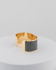 Handcrafted in Tuscany, the MarriCortona Smalto Bracelets in 18k gold and hand-painted enamel feature bold 30 mm bands — radiant, elegant, and uniquely Italian.