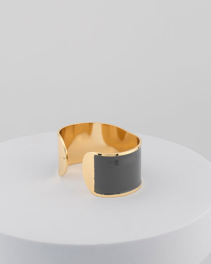 Handcrafted in Tuscany, the MarriCortona Smalto Bracelets in 18k gold and hand-painted enamel feature bold 30 mm bands — radiant, elegant, and uniquely Italian.