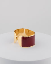Handcrafted in Tuscany, the MarriCortona Smalto Bracelets in 18k gold and hand-painted enamel feature bold 30 mm bands — radiant, elegant, and uniquely Italian.