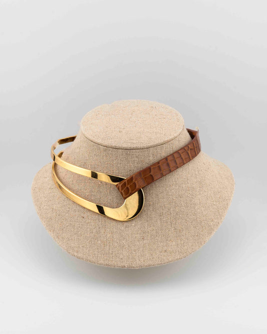 Refined 18K gold-plated bronze choker with genuine crocodile leather.
An exclusive Marri Cortona design — handmade in Tuscany.