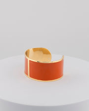 Handcrafted in Tuscany, the MarriCortona Smalto Bracelets in 18k gold and hand-painted enamel feature bold 30 mm bands — radiant, elegant, and uniquely Italian.