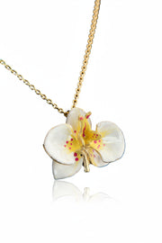 Handcrafted in Tuscany, the Marri Cortona Orchidea Necklace in 18k gold bronze captures the orchid’s grace — elegant, hand-enameled, and timelessly Italian.