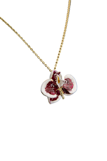 Handcrafted in Tuscany, the Marri Cortona Orchidea Necklace in 18k gold bronze captures the orchid’s grace — elegant, hand-enameled, and timelessly Italian.