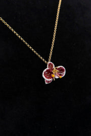 Handcrafted in Tuscany, the Marri Cortona Orchidea Necklace in 18k gold bronze captures the orchid’s grace — elegant, hand-enameled, and timelessly Italian.