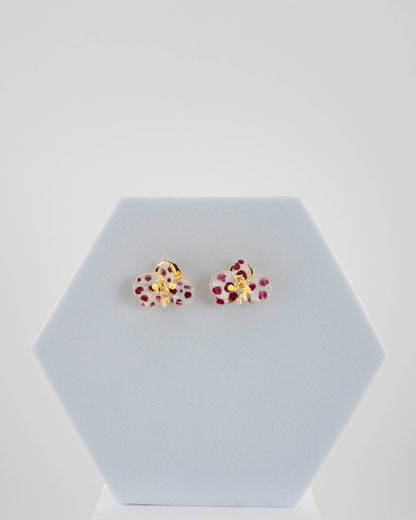 Handcrafted in Tuscany, the Marri Cortona Orchidea Earrings in 18k gold bronze are hand-enameled jewels that blend light, artistry, and timeless elegance.