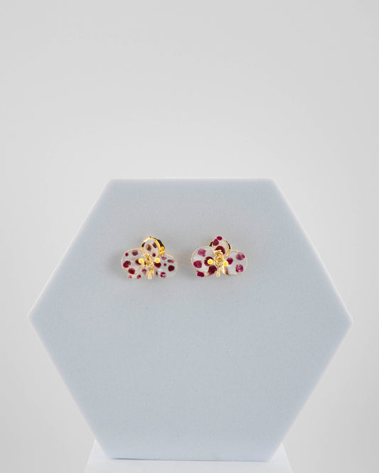 Handcrafted in Tuscany, the Marri Cortona Orchidea Earrings in 18k gold bronze are hand-enameled jewels that blend light, artistry, and timeless elegance.