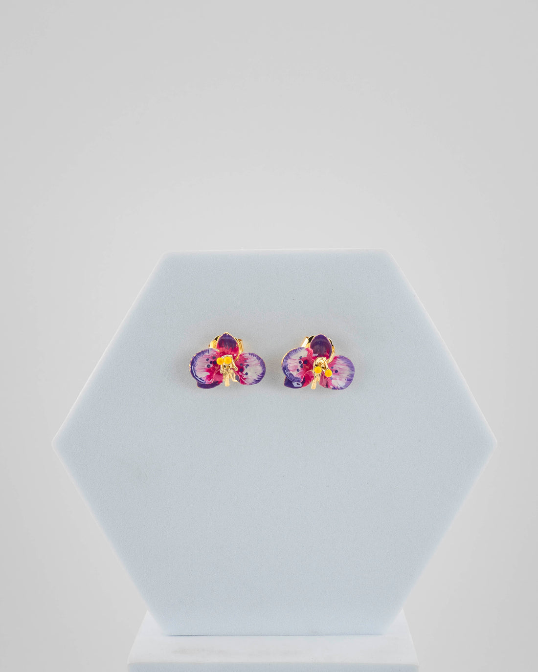 Handcrafted in Tuscany, the Marri Cortona Orchidea Earrings in 18k gold bronze are hand-enameled jewels that blend light, artistry, and timeless elegance.