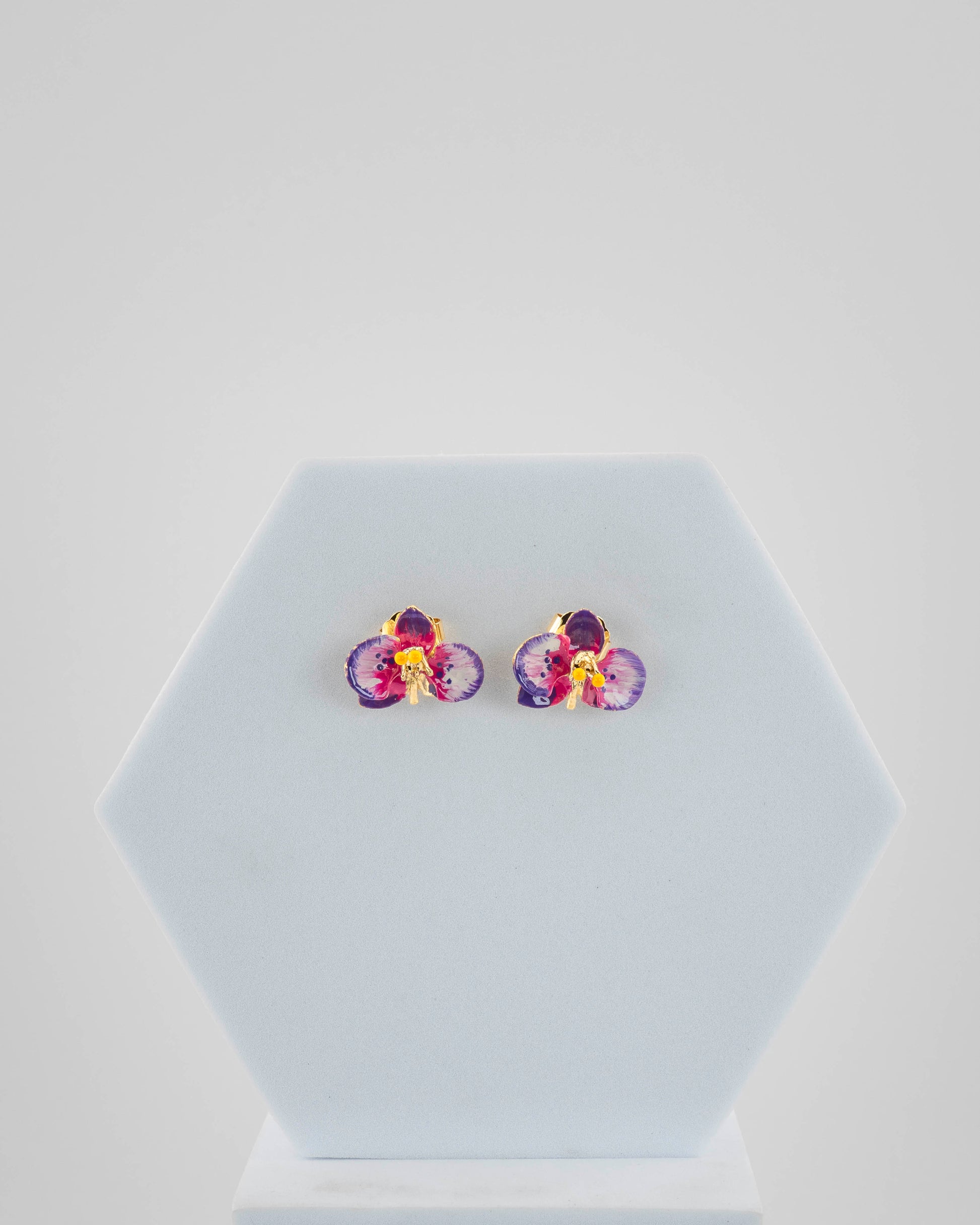 Handcrafted in Tuscany, the Marri Cortona Orchidea Earrings in 18k gold bronze are hand-enameled jewels that blend light, artistry, and timeless elegance.